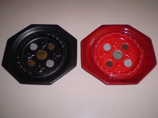 Haeger 1032 ashtray decorated with coins [mat black and red glaze]